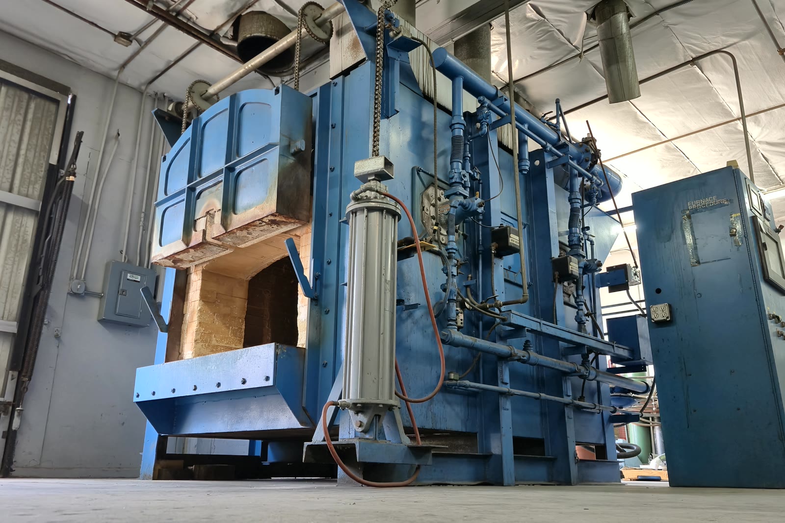 DCWI's large Baker box furnace for in-house aerospace weld stress relief, brick chamber open and ready to load
