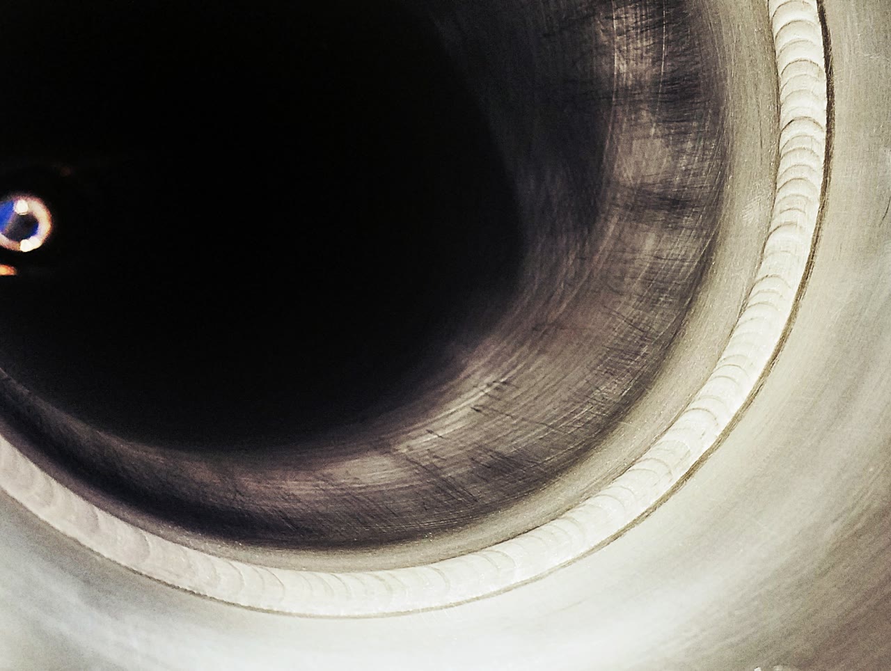 A circumferential DCWI orbital weld inside an aluminum tube bore